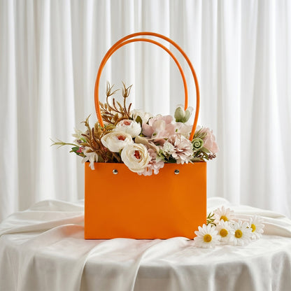 Foldable flower packaging bag with handle for bouquets and gifts, by Wukusy, shown open and ready for floral arrangements.