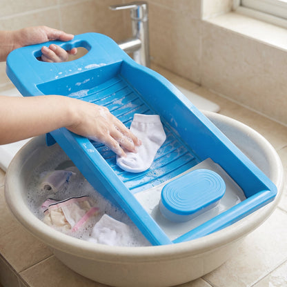 Portable plastic mini washing board with soap holder for laundry, ideal for washing socks and small clothing items by Wukusy.