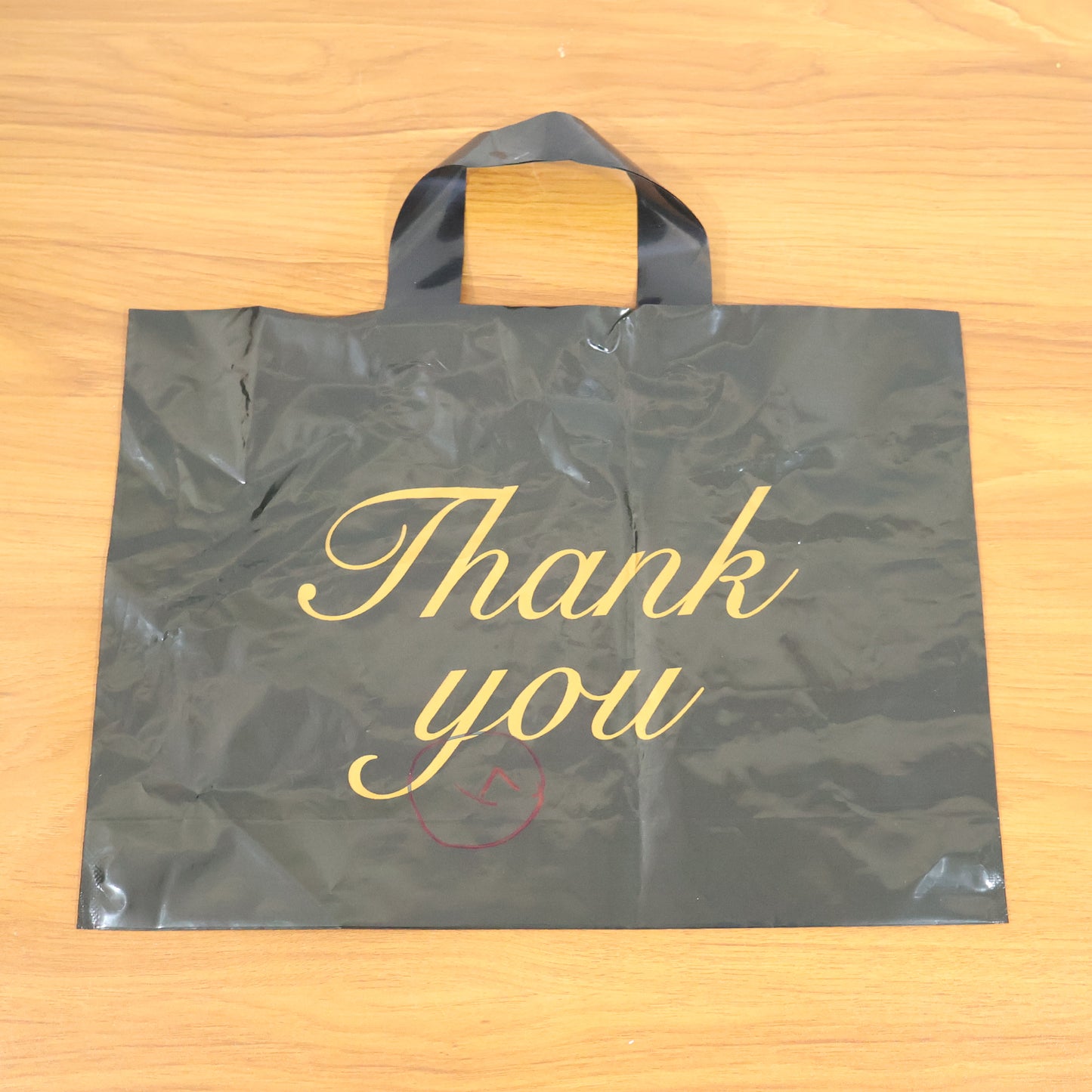 Wukusy premium thank you printed carry bag with handles, 25.34 cm, showcasing elegant thank you message on durable paper bag.