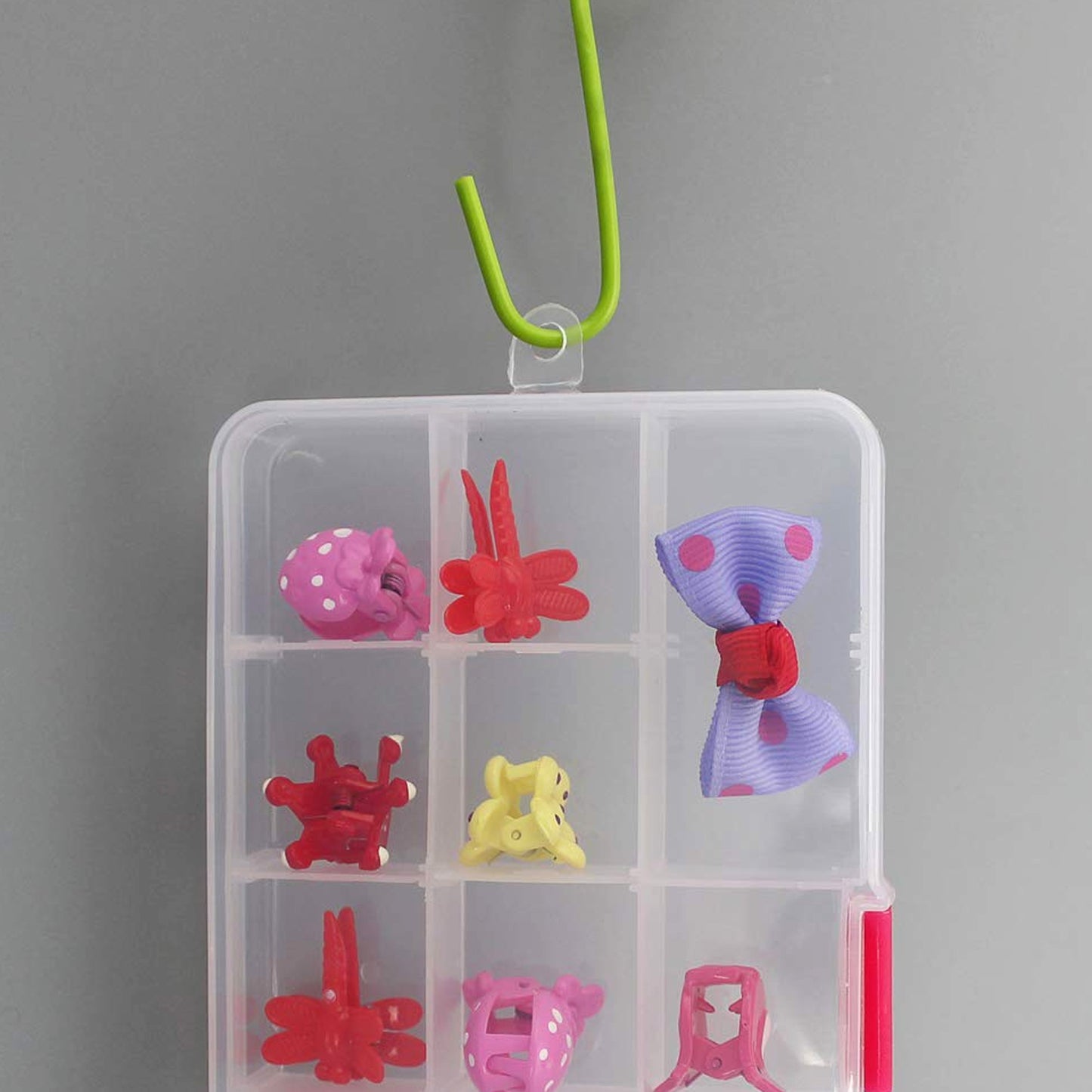 Clear Wukusy 15-grid plastic jewelry organizer box with adjustable dividers for beads, herbs, pills, and small jewelry items.