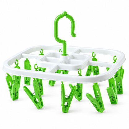 Plastic clip hanger drying rack with detachable hook for socks and small clothes, by Wukusy, shown holding small laundry items.