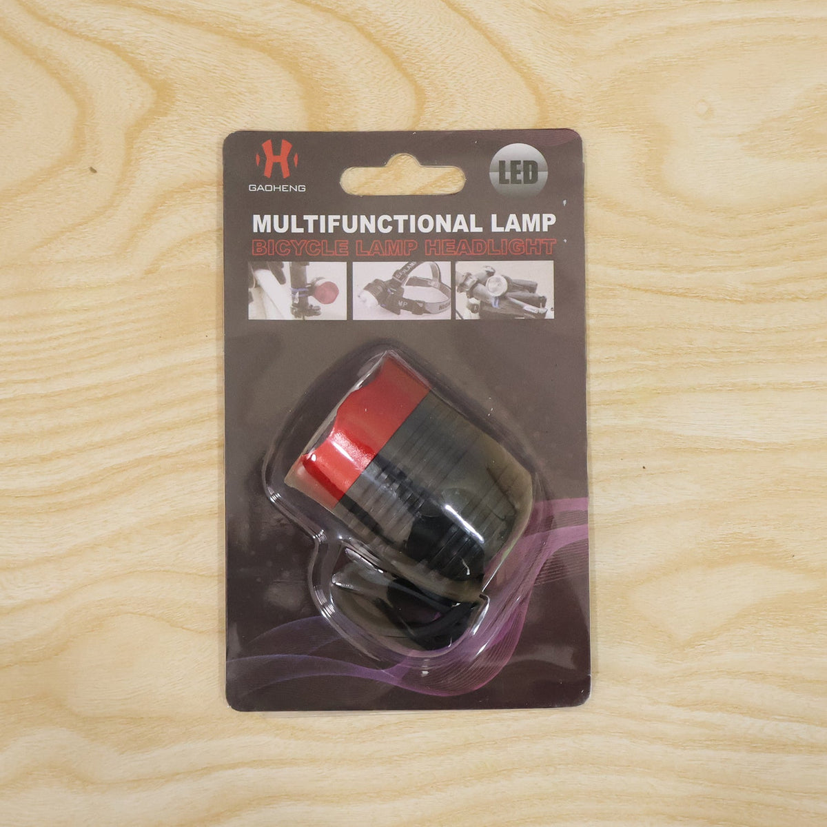 Wukusy compact bicycle headlight with handlebar mount, designed for night cycling safety, mounted on a bike handlebar.