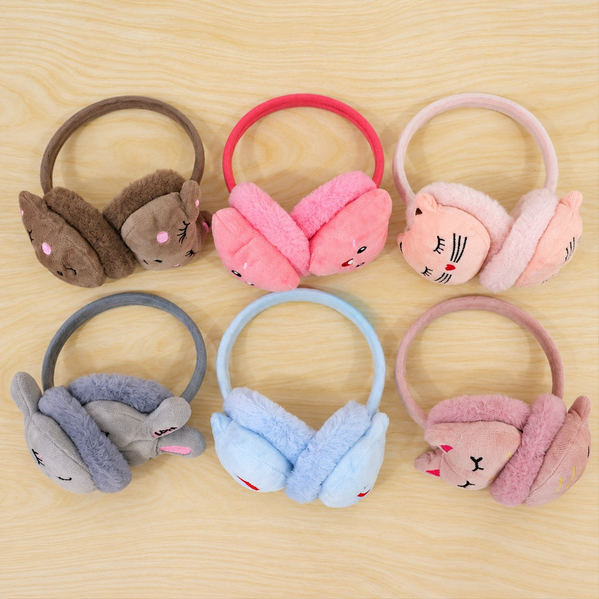 Wukusy plush winter ear muffs featuring cute animal face designs in various colors, soft and cozy for cold weather.