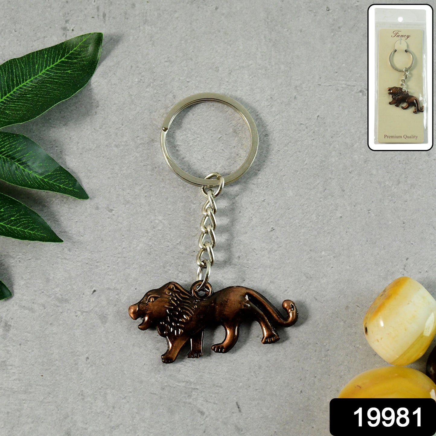 Elegant metal lion keychain by Wukusy, featuring a detailed walking lion design on a sturdy keyring.