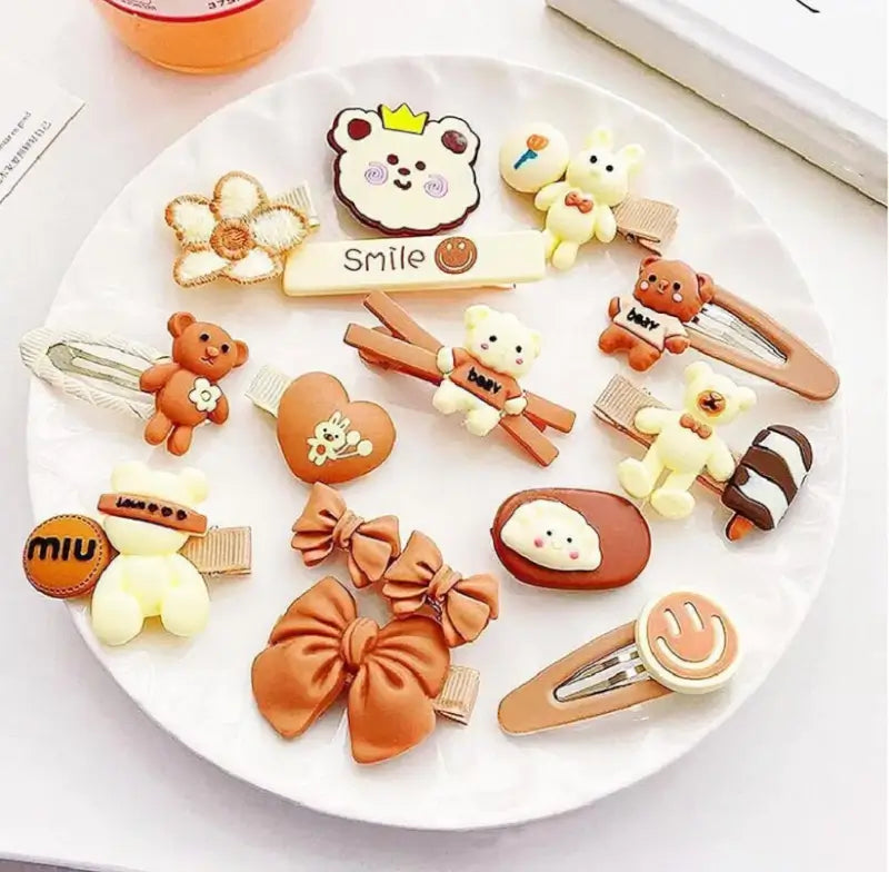 Ekom 14-piece teddy bow hair clips set with small multicolor rubber clips for children and women's hair styling.