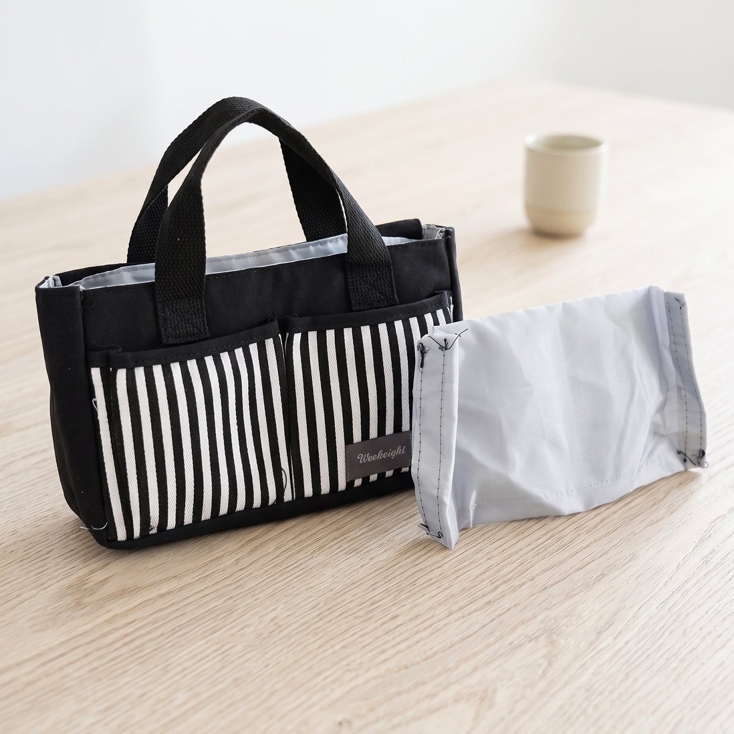 Wukusy multipurpose travel organizer bag with handles, 27x16 cm, showing compartments and zipper closure for efficient packing.
