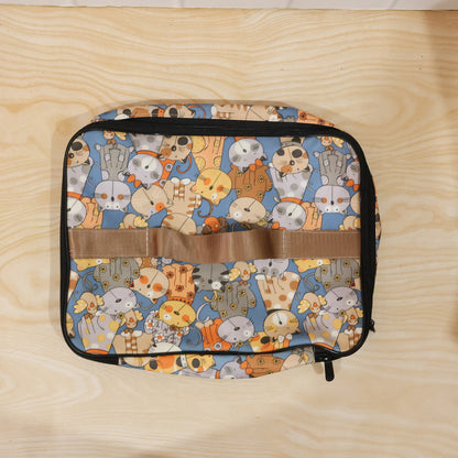Wukusy lightweight multipurpose travel organizer bag with multiple compartments for storing travel essentials in a compact pouch.