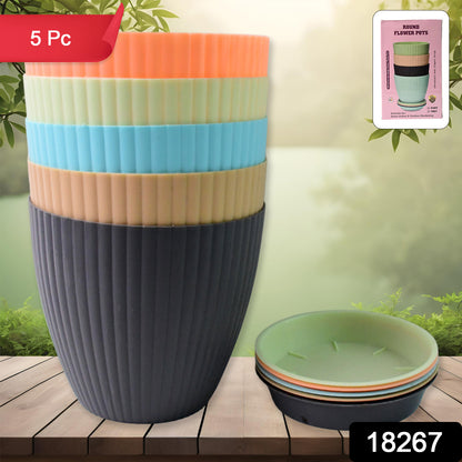 Set of five Wukusy plastic flower pots with matching bottom trays, ideal for indoor and outdoor gardening.
