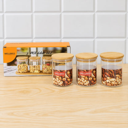 Set of three Wukusy glass storage jars with bamboo lids, ideal for kitchen organization and dry foods or fruits.