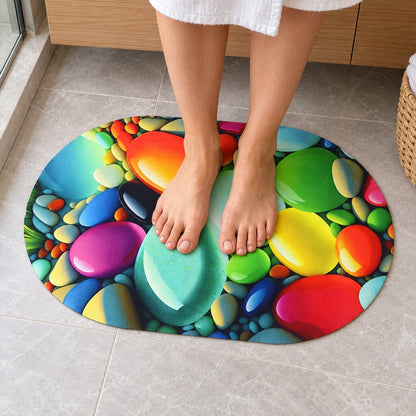 Colorful pebble print oval door mat by Wukusy, 57.5x38 cm, designed for home floor decor with vibrant pebble pattern.