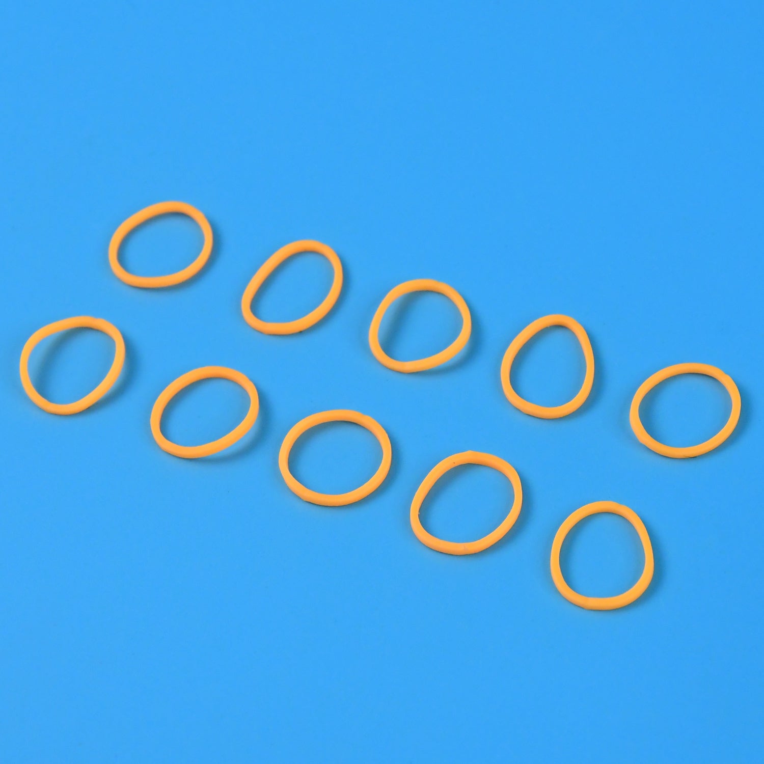 Wukusy premium strong elastic rubber bands for home improvement, shown stretched and coiled, versatile multipurpose bands.