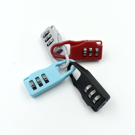 Wukusy 6109 3-digit luggage lock with key and tool, used for securing baggage and travel items.