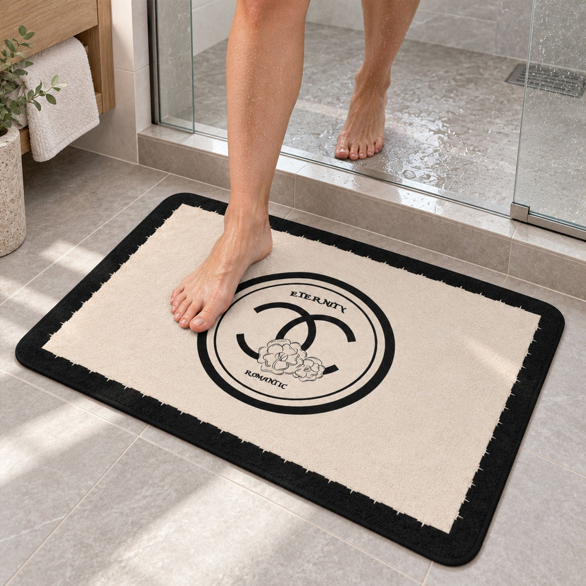 Black and cream Wukusy bath mat with soft, textured, absorbent surface, measuring 40x30 cm, for bathroom floor decor.