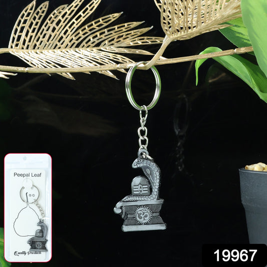 Silver Shivling keychain with snake design from Wukusy, featuring detailed craftsmanship and a compact, decorative accessory.