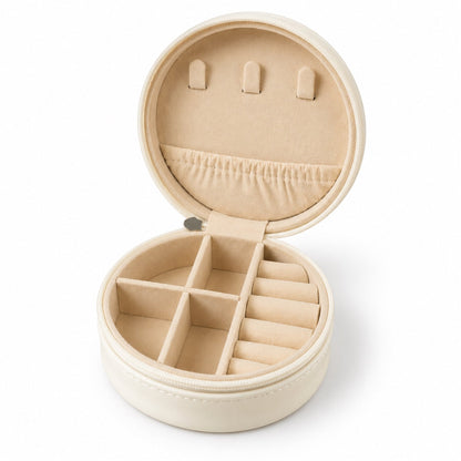 Wukusy round jewelry organizer box with ring rolls and zip closure for travel, featuring compartments for necklaces and earrings.
