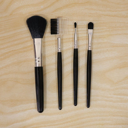 Wukusy 5-piece mini makeup brush set for face, eyes, eyebrows, and lips with compact tools on a white background.