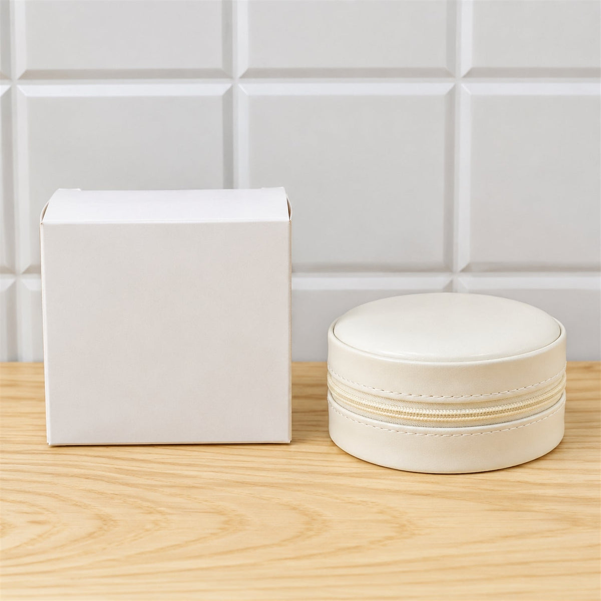 Wukusy round jewelry organizer box with ring rolls and zip closure, ideal for travel storage of rings and small jewelry items.