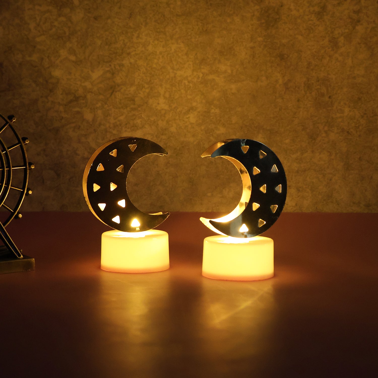 Set of four Wukusy decorative moon-shaped flameless LED candles for home decor, featuring soft glowing light and moon design.
