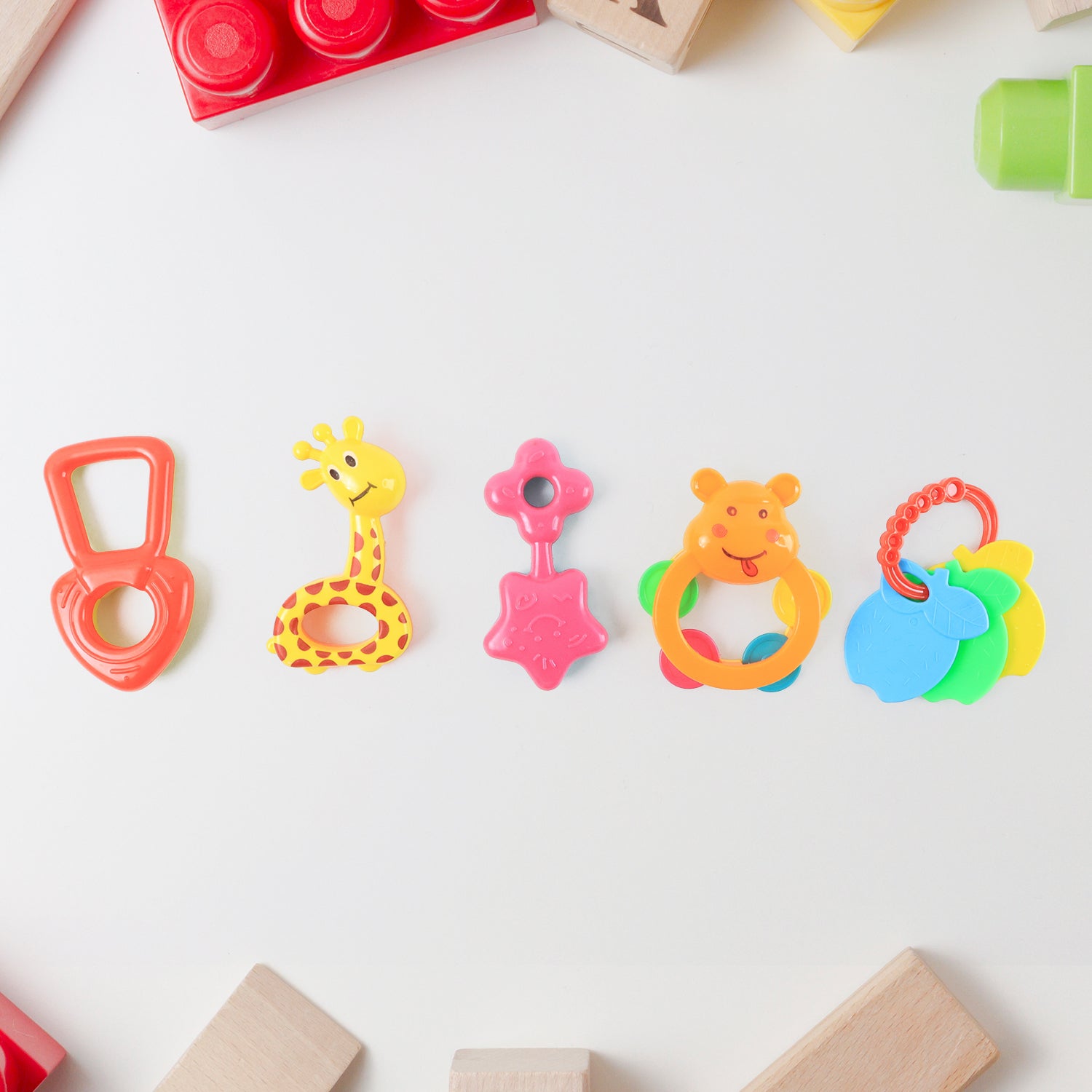 Set of five colorful Wukusy plastic baby rattle toys, designed for infants to shake and grasp for sensory play.