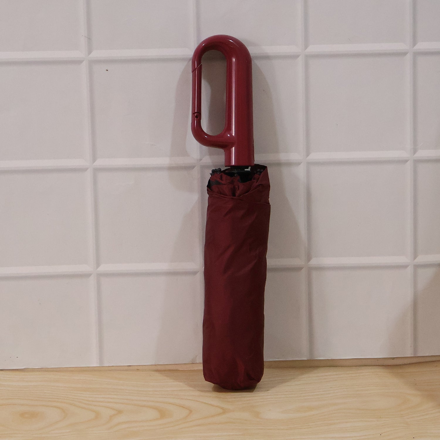 Wukusy portable windproof travel umbrella, compact and durable for rain and sun, shown open with black canopy.