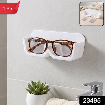Wall-mounted Wukusy plastic sunglasses holder stand with adhesive, designed to organize and display eyewear securely.