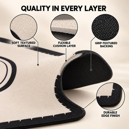 Black and cream Wukusy bath mat with soft, textured, absorbent surface in 40x30 cm size, ideal for bathroom floors.