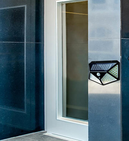 Wukusy 1255 solar garden LED security lamp illuminating outdoor pathways and home exterior at night.