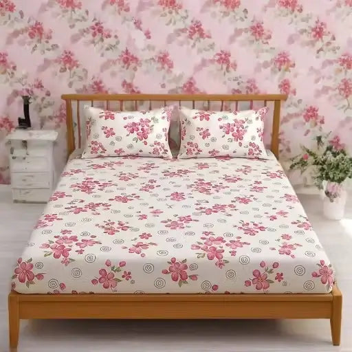 Ekom floral cotton fitted bedsheet in king size with matching pillow covers, featuring a vibrant floral pattern on soft cotton fabric.