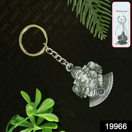 Silver Lord Ganesha sitting design keychain by Wukusy, featuring detailed Ganesha figure on a silver keychain.