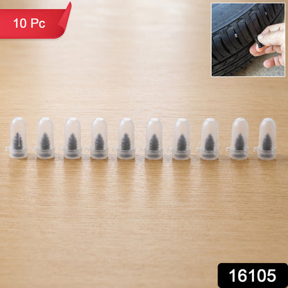 Set of 10 black Wukusy car bike tire puncture repair nails and screws on a plain background.