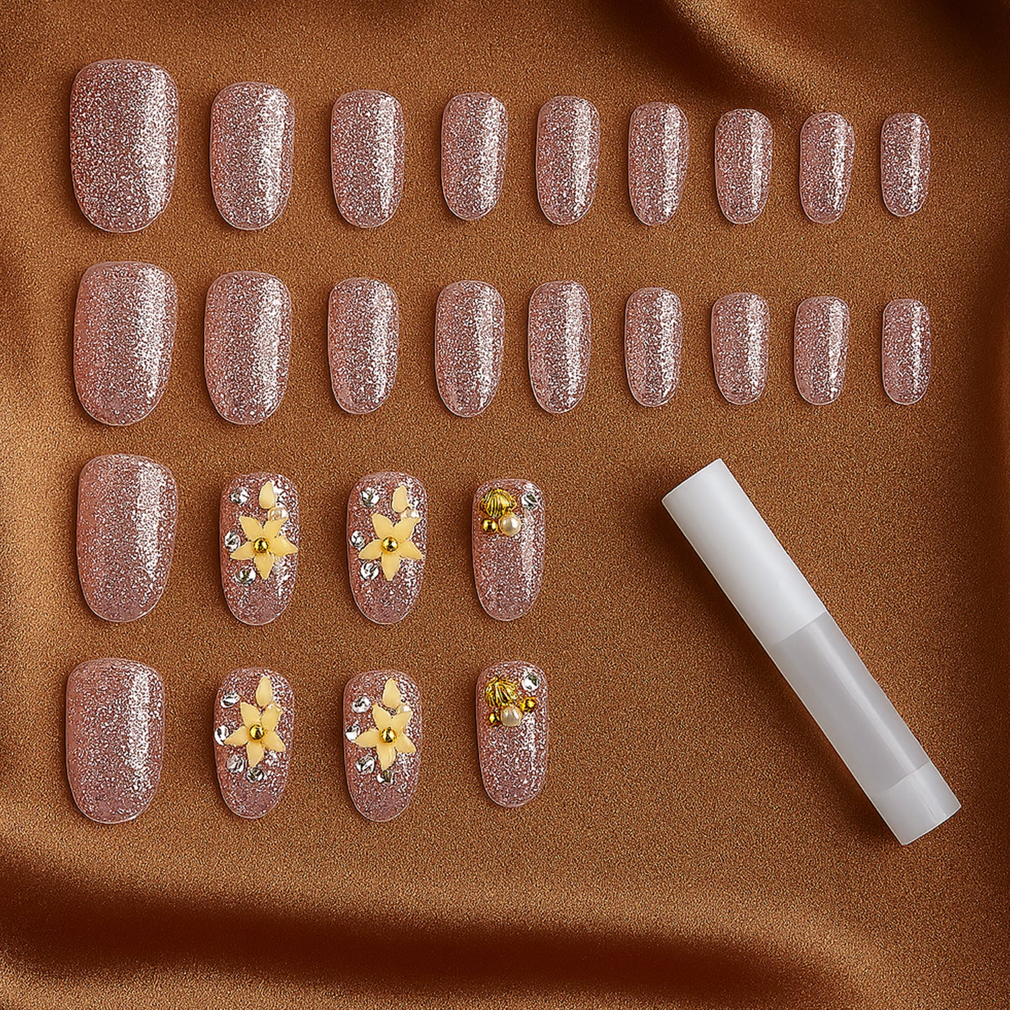 Wukusy premium glitter 3D floral press-on artificial nail tips with nail glue, featuring sparkling floral designs in a set