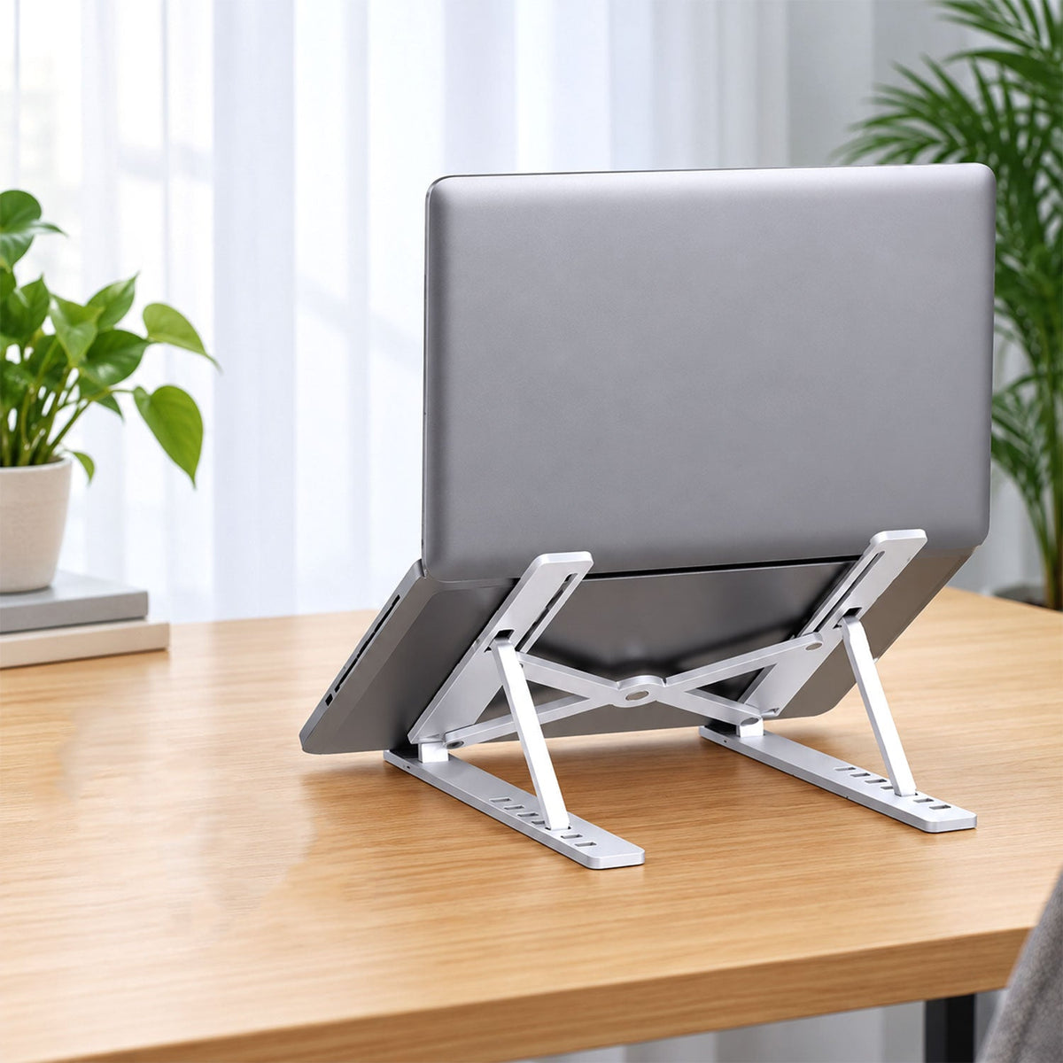 Wukusy portable foldable laptop stand with adjustable height and angle for ergonomic work setup, shown in open position.