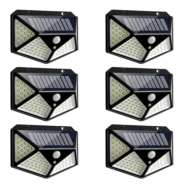 Wukusy 1255 solar garden LED security lights illuminating outdoor pathways and home exterior at night