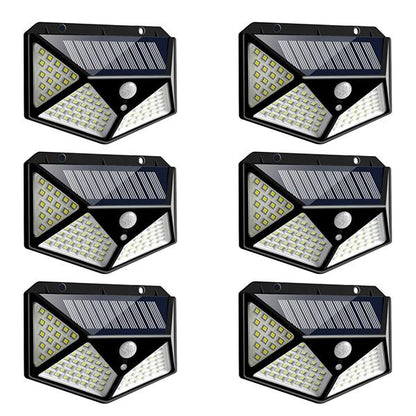 Wukusy 1255 solar garden LED security lights illuminating outdoor pathways and home exterior at night