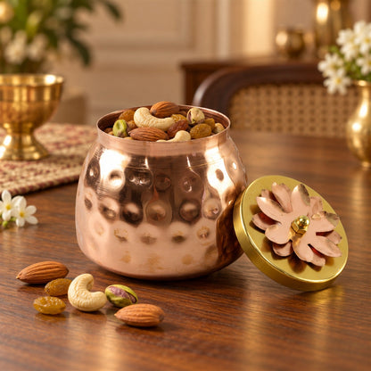 Copper finish storage jar with flower lid for dry fruits, decorative home decor by Wukusy, close-up of jar on table.