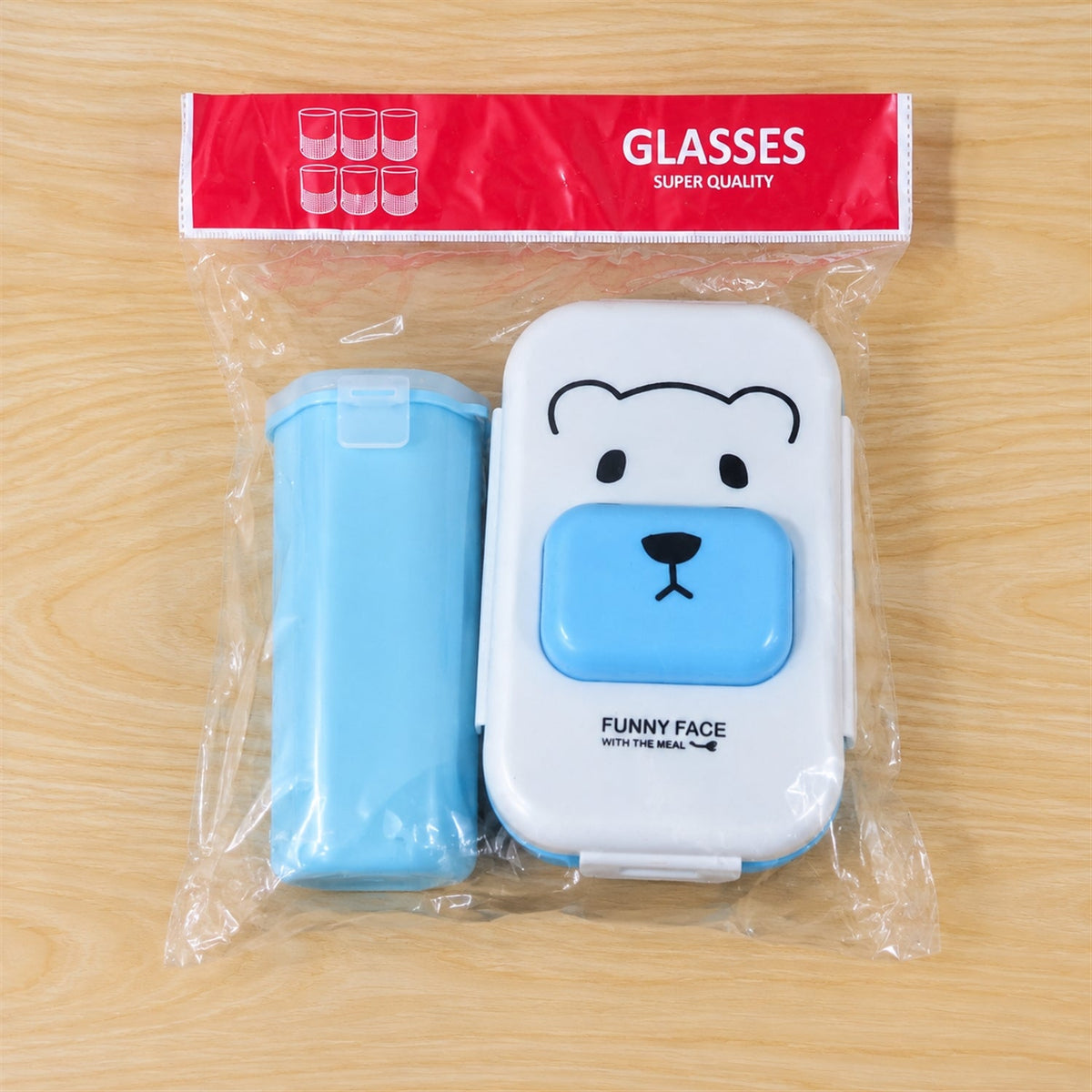 Kids lunch box set with water bottle and spoon by Wukusy, featuring colorful compartments for school meals and snacks.