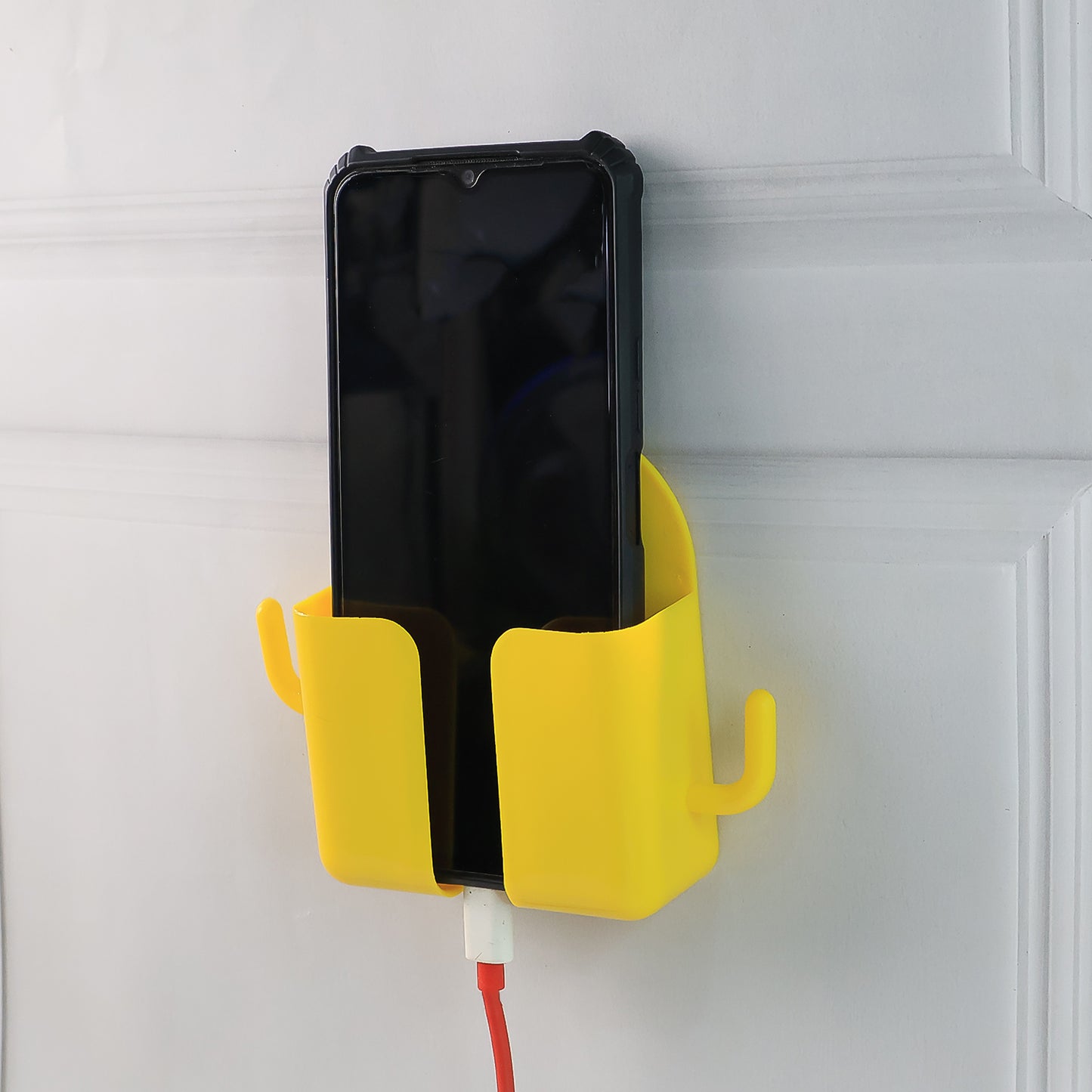 Orange wall-mount mobile stand with hook by Wukusy, designed for holding smartphones and accessories efficiently.