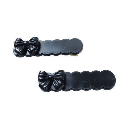 Set of three black bow decorative hair clips by Wukusy, featuring elegant design for stylish hair accessories.