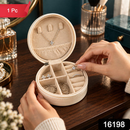 Wukusy round jewelry organizer box with ring rolls and zip closure, perfect for travel storage of rings and small jewelry pieces.