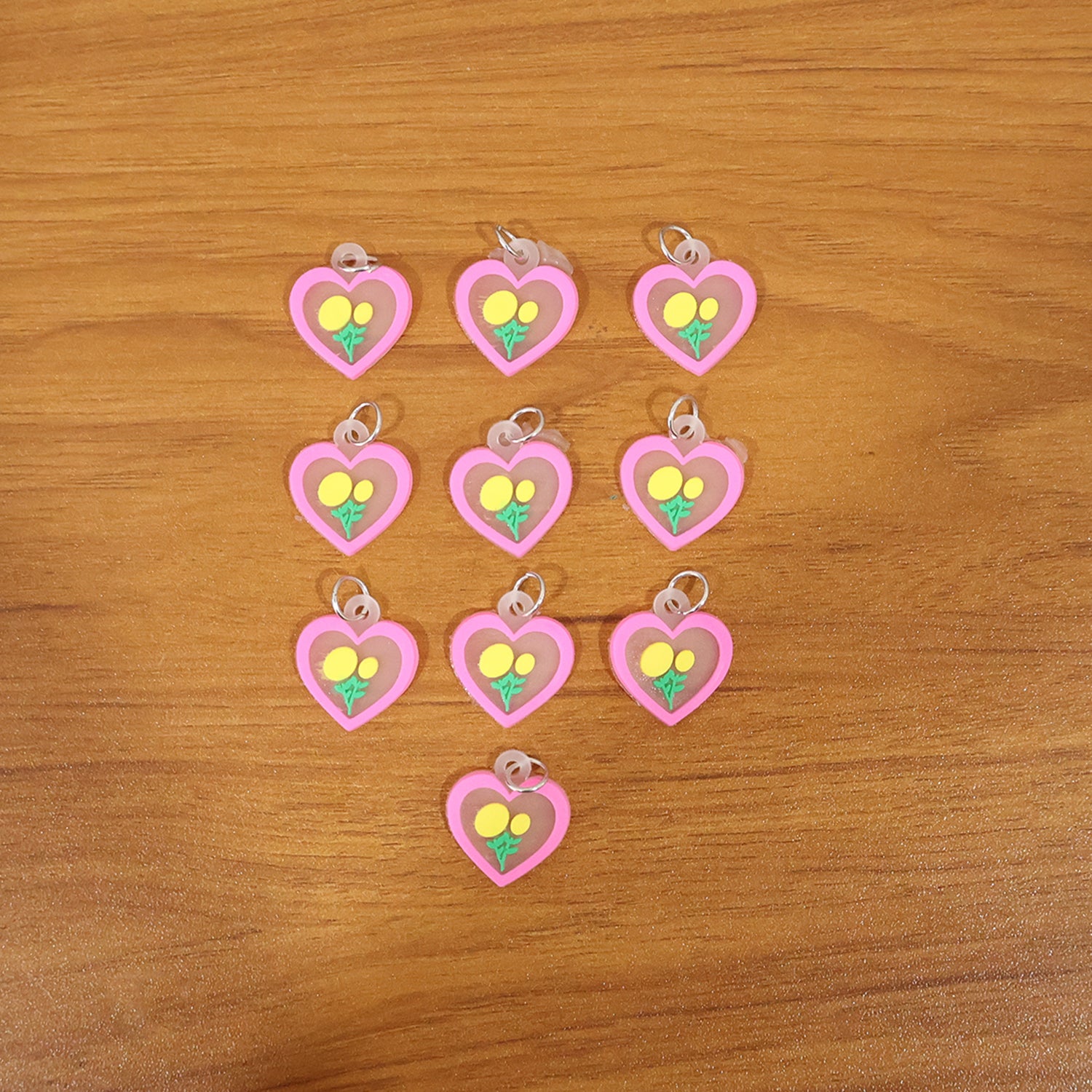 Set of 10 Wukusy heart flower design bag charm keychains with cute floral motifs and vibrant colors.