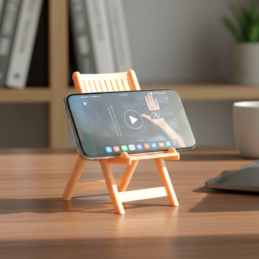 Peach-colored Wukusy mini chair-shaped mobile stand holder on a white background, showcasing its compact design and colorful appearance.