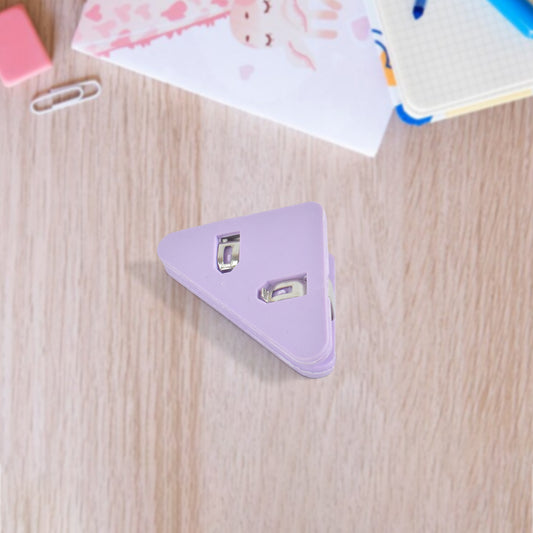 Small Wukusy triangle paper clip for securing paper documents, ideal for office use, shown holding papers in a corner.