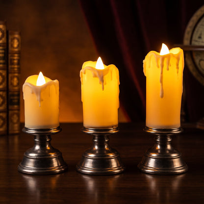 Set of three Wukusy plastic flameless LED candles with pedestal stands, ideal for decorative home or event displays.