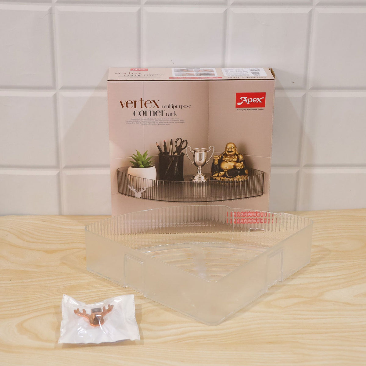 Wukusy Apex transparent corner rack with adhesive mounts for bathroom storage, shown installed in a modern bathroom corner.