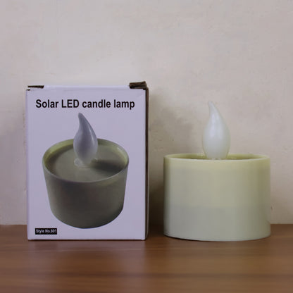 Wukusy solar powered LED flameless candle light emitting a warm glow, ideal for ambient decorative lighting.