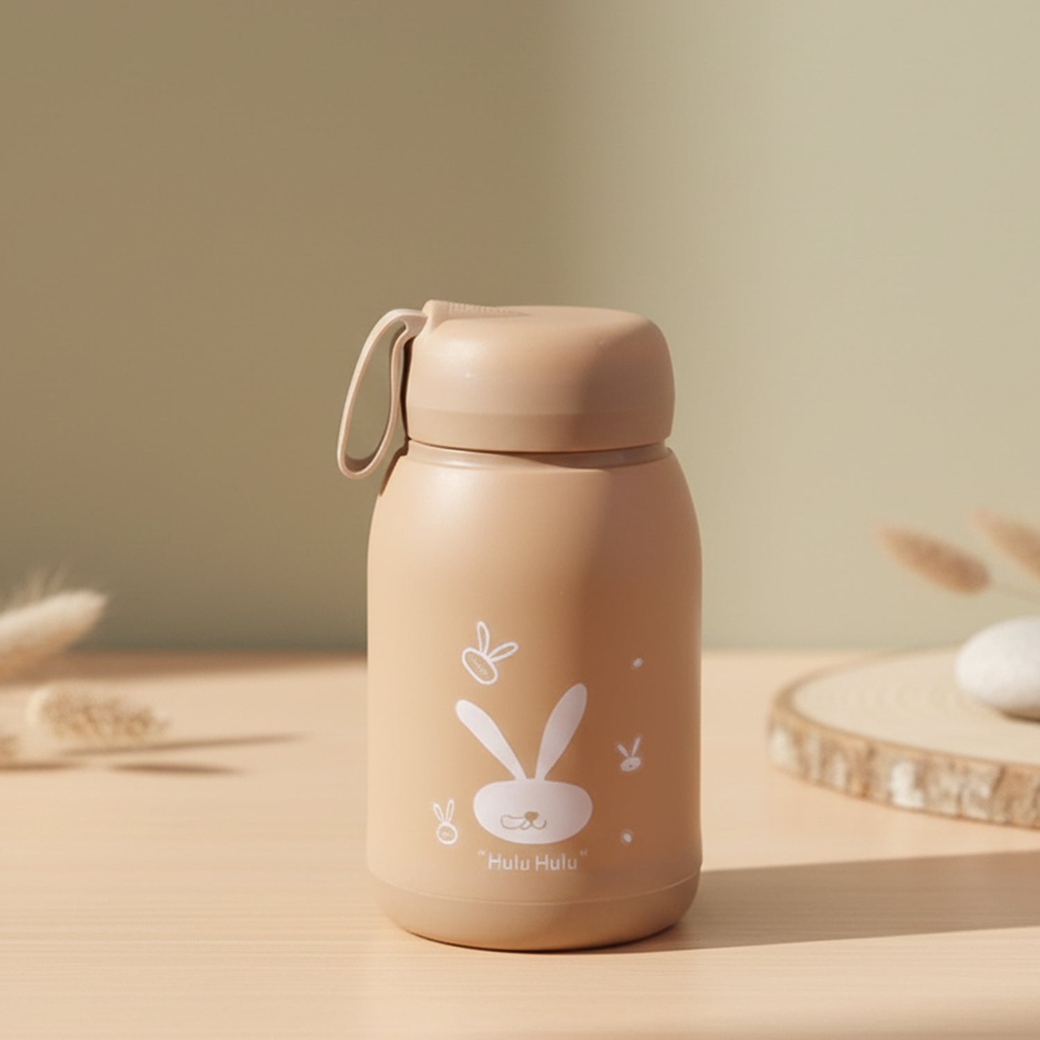 Wukusy cute bunny print glass drinking bottle with brown tint, 330ml capacity, featuring adorable bunny illustrations on the surface.