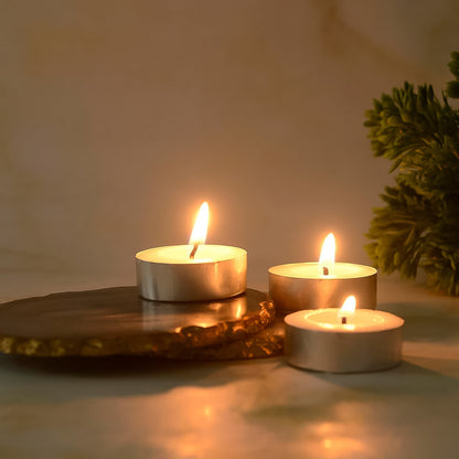 Wukusy tealight candles set with 50 smokeless candles, small circular wax candles in a natural setting, ideal for ambiance.