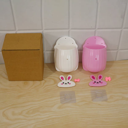 Wukusy rabbit design wall-mounted toothbrush holder set with two pieces for bathroom storage, featuring playful rabbit motifs.