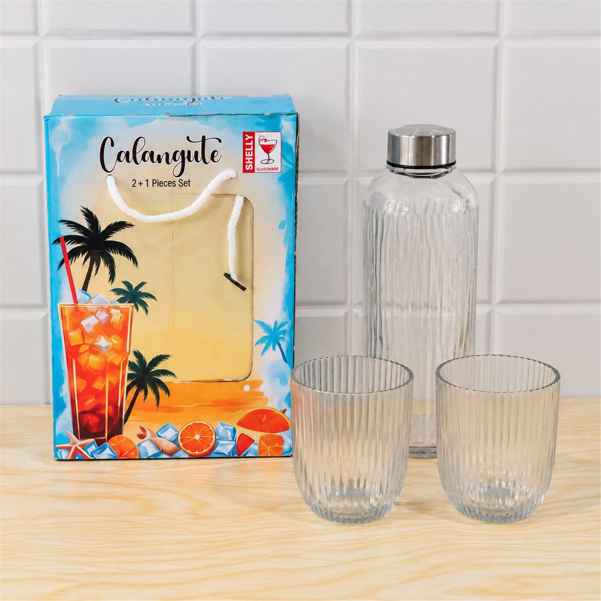 Wukusy ribbed water bottle with two matching glasses in a 3-piece gift set, showcasing the sleek, textured design and clear glassware.