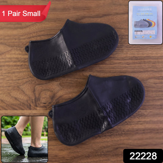 Pair of black Wukusy reusable waterproof silicone rain shoe covers with non-slip soles, small size, designed for wet weather protection.